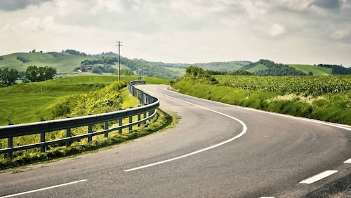 Well maintained road with surrounding of trees
