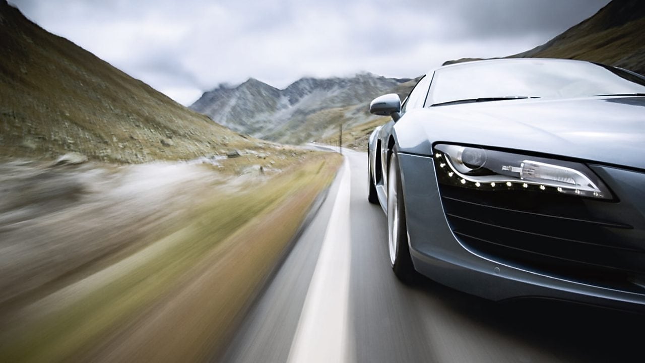 car driving along a winding mountain road