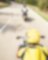 Three motorbikes being ridden along a mountain road