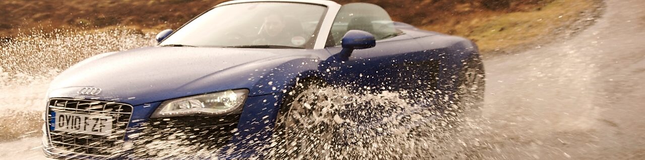Car driving into the water on the country road