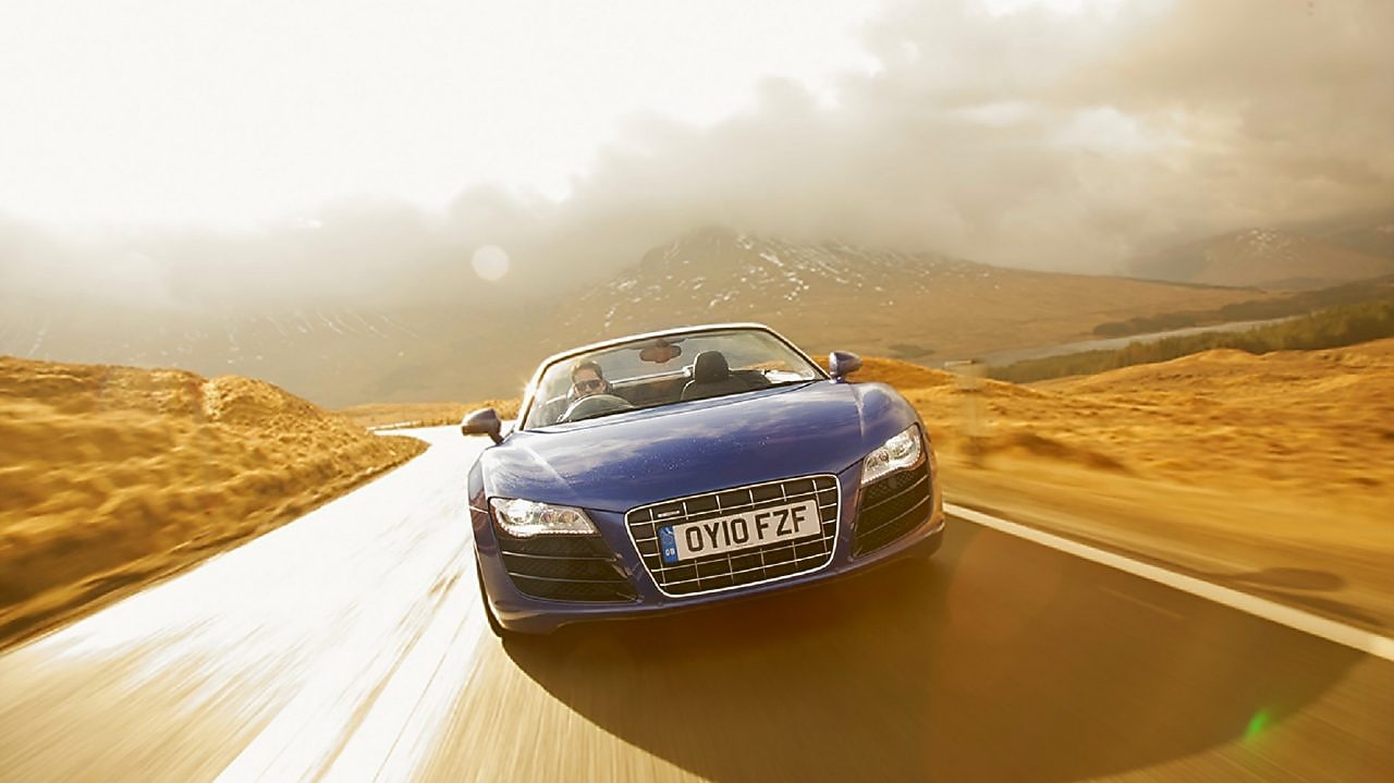 Car driving into the water on the country road