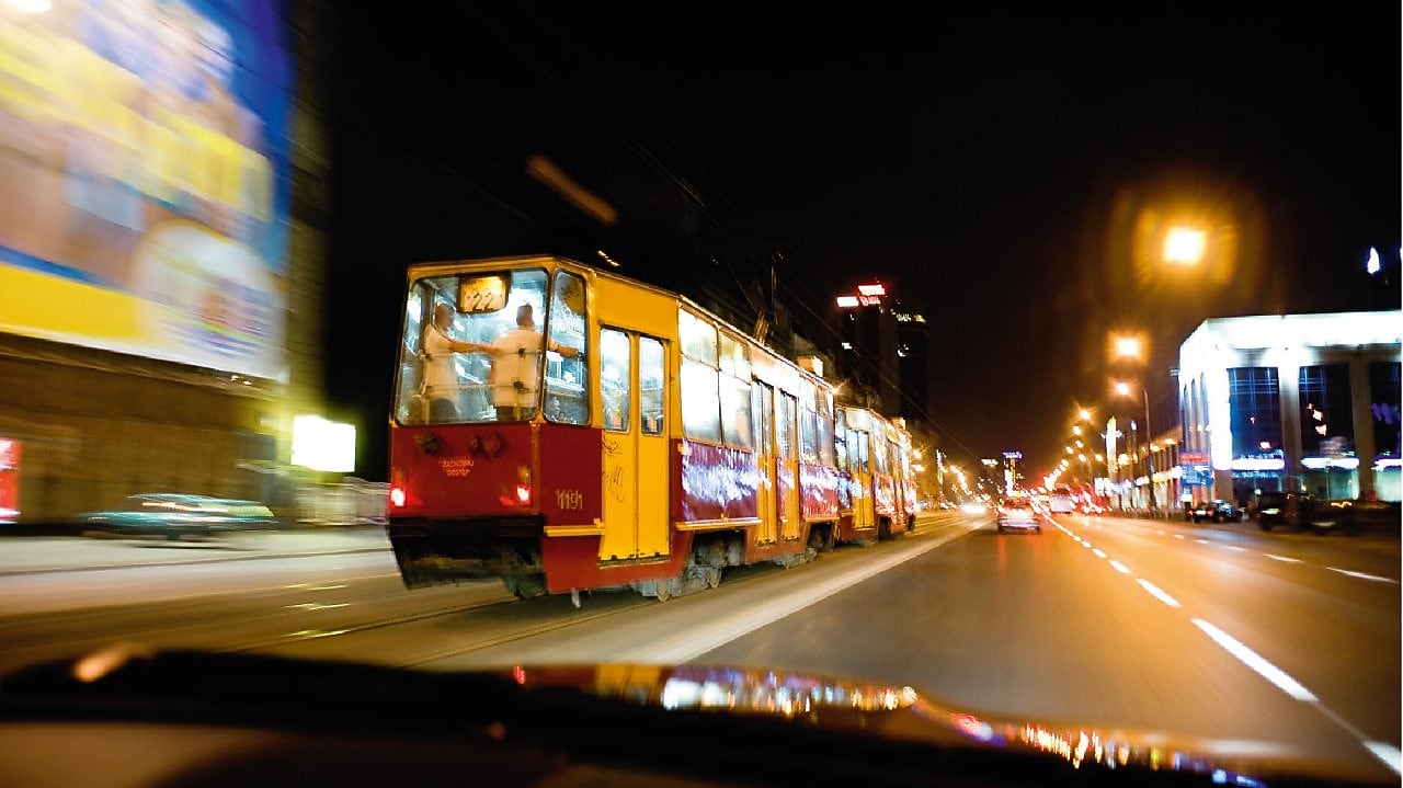 Tram on the street in Warsaw at night