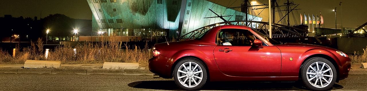 Red car parked on the streets of Amsterdam