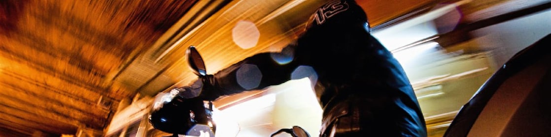 Man riding a bike in Marakesh at night