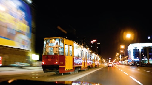 Tram on the street in Warsaw at night