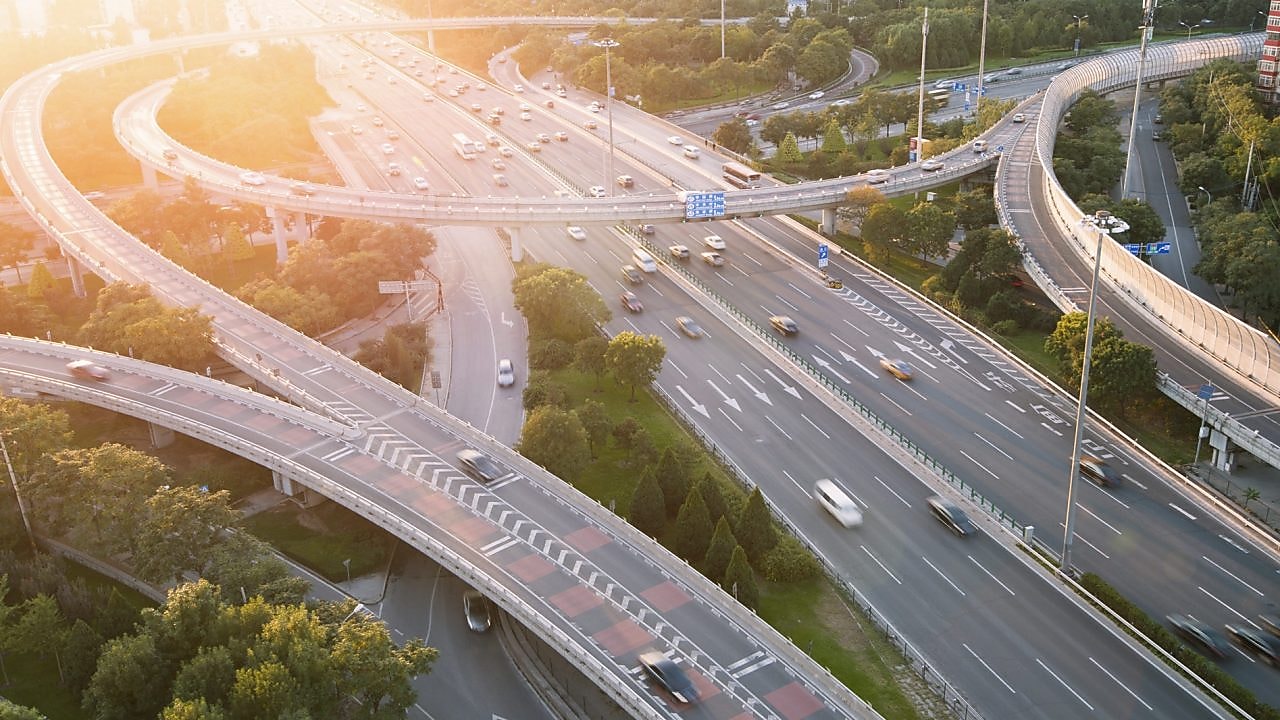 Cars driving on a complicated highway infrastructure with over and under passes