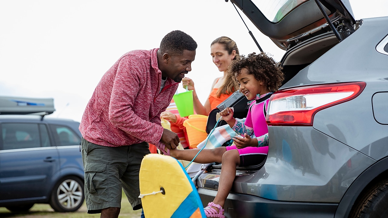 Family in car going to the beach