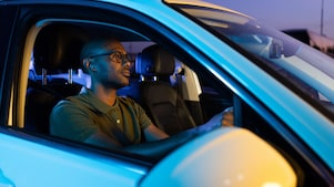 man in car