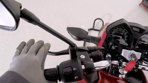 hand holding the clutch on a motorcycle