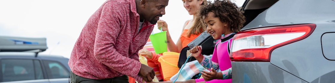 Family in car going to the beach