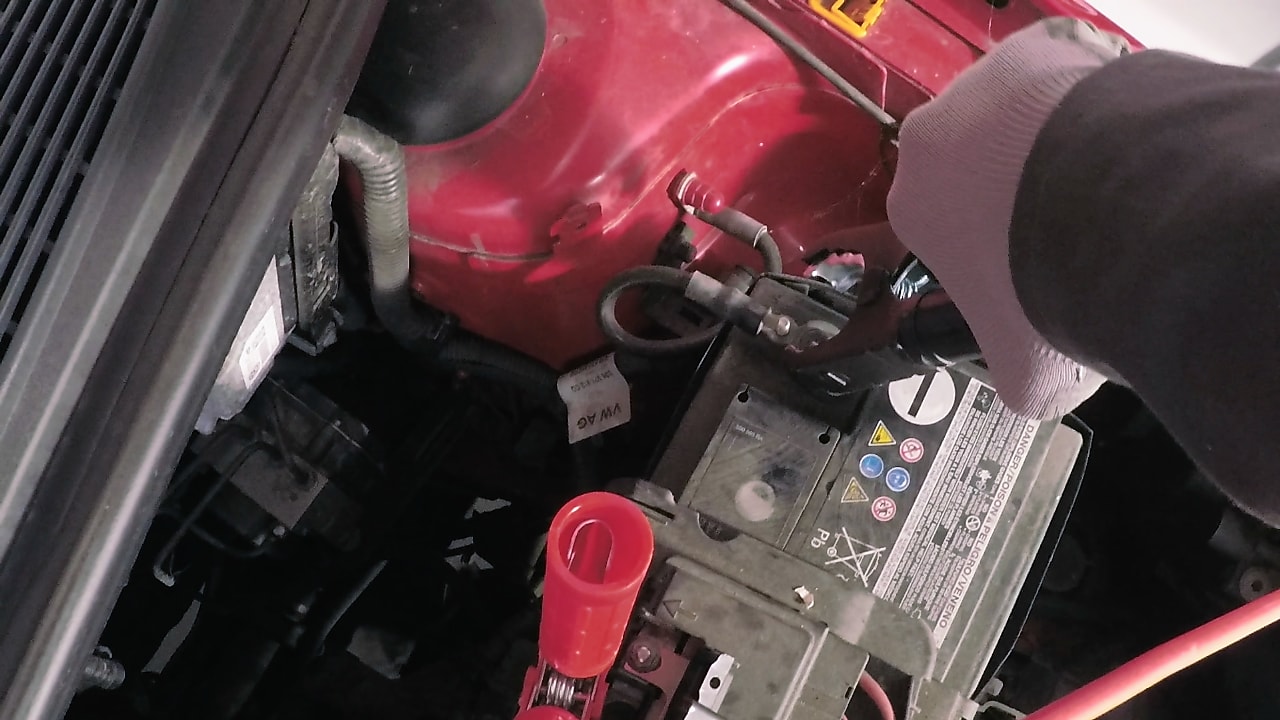 hand connecting two batteries