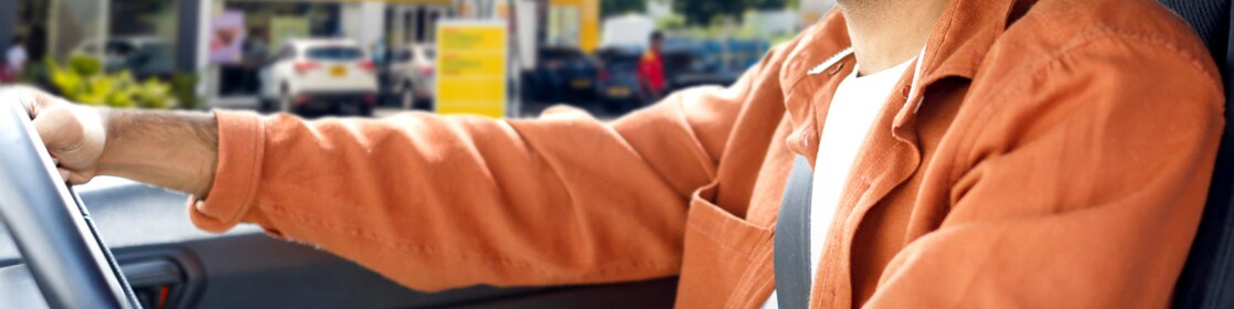 A person in a car on Shell station