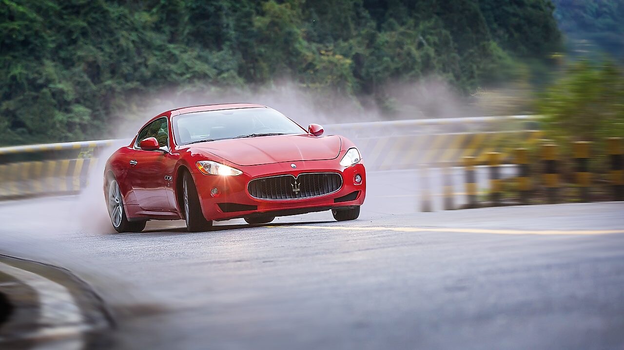 A red Maserati speeds uphill in the Shell Helix Ultra film We Know Why You Drive