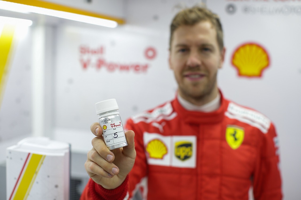 hands holding a v-power tube on a shell lab
