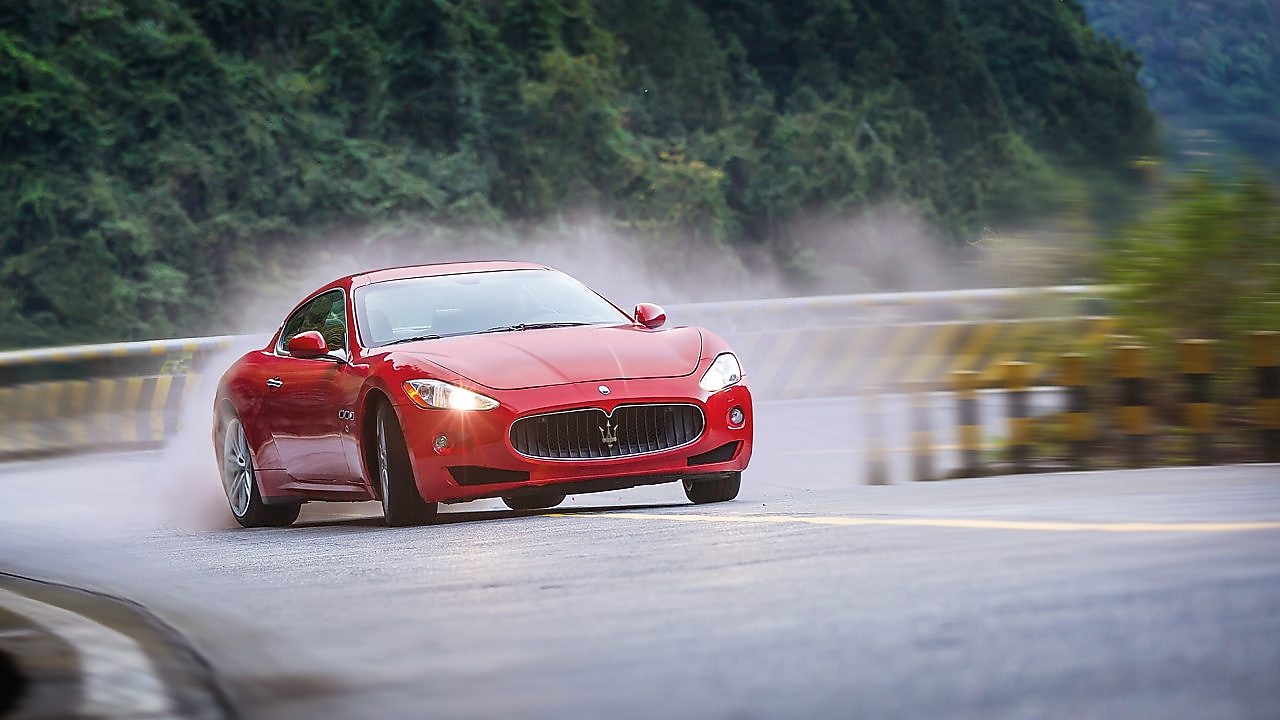 A red Maserati speeds uphill in the Shell Helix Ultra film We Know Why You Drive