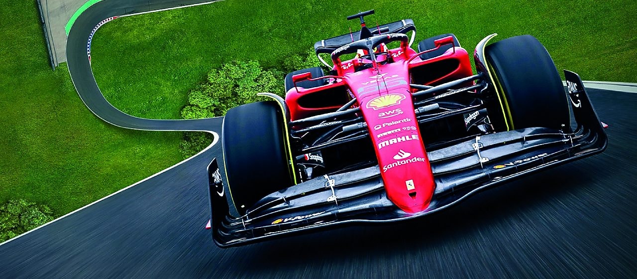 A red Scuderia Ferrari F1 car on a track with a distorted perspective to elongate the length of the track