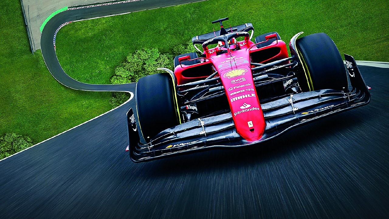 A red Scuderia Ferrari F1 car on a track with a distorted perspective to elongate the length of the track