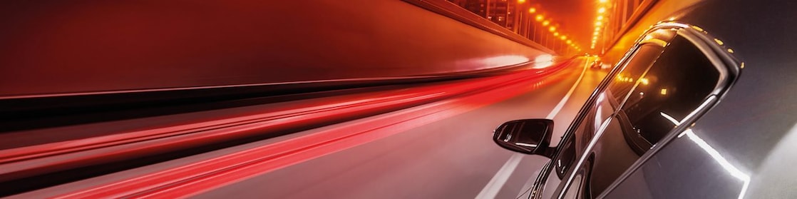 Car speeding down a road 