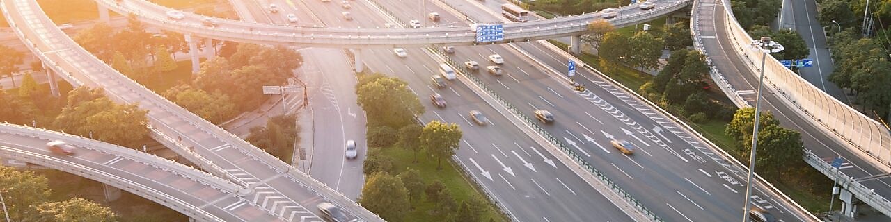 Cars driving on a complicated highway infrastructure with over and under passes